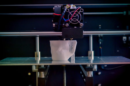 Objects printed by 3d printer. Dark filter. Copy spase. Automatic three dimensional 3d printer performs plastic modeling in laboratory. Progressive modern additive technologyの写真素材
