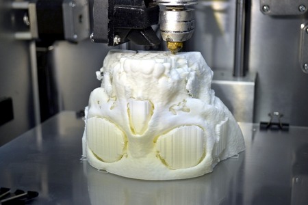 3D printer prints the form of molten plastic white close-up. Automatic three dimensional 3d printer...