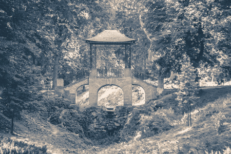 Old vintage photo. Chinese-style bridge in park copy spaceの写真素材