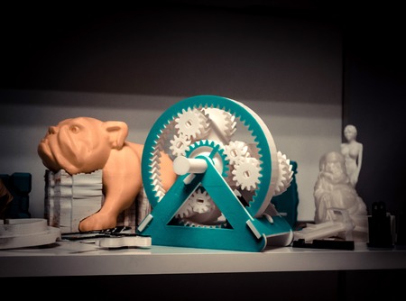 object different models skeleton printed by 3d printer. Dark filter. Automatic three dimensional 3d printer performs plastic green colors modeling in laboratory. Modern 3D printing technology.の写真素材