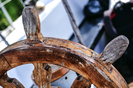 Wooden and Vintage old Steering wheel Handwheel ship close upの写真素材
