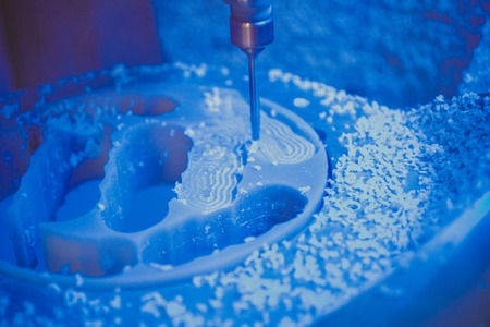 Dental milling machine carving out shape of human teeth close-upの写真素材