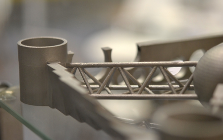 Object printed on metal 3d printer. A model created in a laser sintering machine close-up. DMLS, SLM, SLS technology. Concept of 4.0 industrial revolution. Progressive modern additive technology.の写真素材