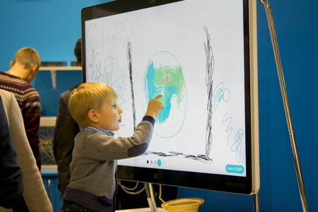 Kiev, Ukraine October 7, 2017: Draws finger large touch screenのeditorial素材