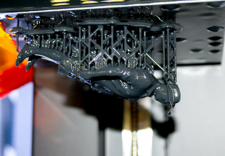 Stereolithography DPL 3d printer create detail and liquid drips, platform slowly move with liquid...