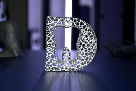 Abstract object of a gray color printed on a 3d printer on black dark surface. Fused deposition modeling, FDM. Progressive modern additive technology. Concept of 4.0 industrial revolutionの写真素材