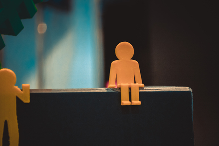 Abstract object in form of little men of yellow color printed on 3d printer close-up. Fused deposition modeling, FDM. Progressive modern additive technology. Concept of 4.0 industrial revolutionの写真素材