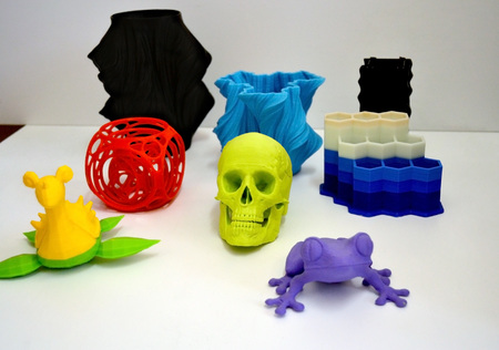 Objects printed by 3d printer Isolated on white background. Bright colorful object. Automatic three...