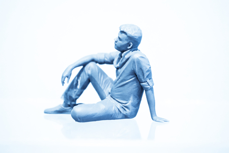 Man's form printed by 3d printer from a photopolymer material. Stereolithography 3D printer, technology of liquid photopolymerization under UV light. Modern additive and medical technologiesの写真素材