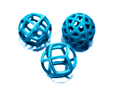 Abstract object of a green color printed by 3d printer on white background. Fused deposition modeling, FDM. Progressive modern additive technology. Concept of 4.0 industrial revolutionの写真素材