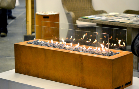 Modern bio fireplot fireplace on ethanol gas. Smart ecological alternative technologies....