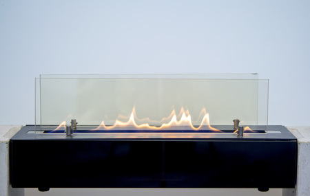 Modern bio fireplot fireplace on ethanol gas. Smart ecological alternative technologies....
