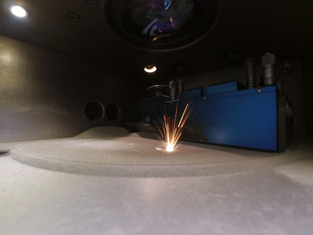 Laser sintering machine for metal. Metal is sintered under the action of laser into desired shape in...