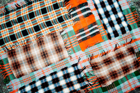 background multicolored old wool blanket stitched  cell