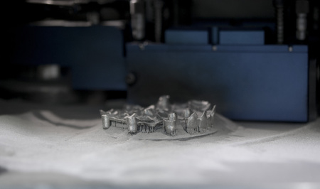 Object printed on metal 3d printer, laser sintering machine for metal close-up. A metal object...