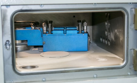 Object printed on metal 3d printer, laser sintering machine for metal close-up. A metal object...