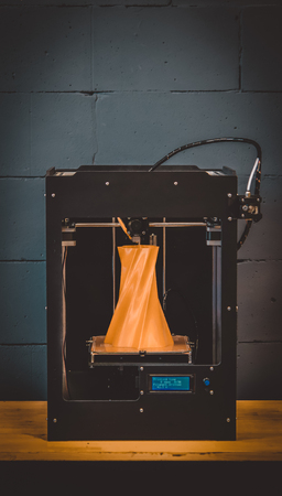 3D printer working close up. Automatic three dimensional 3d printer performs plastic. Modern 3D printer printing an object from the hot molten. Concept progressive additive technology for 3d printing.の写真素材
