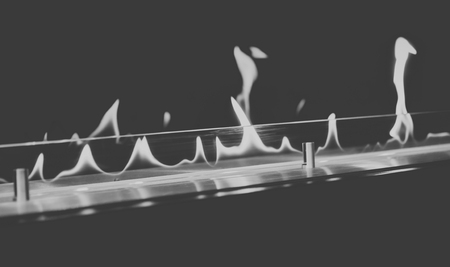 Modern bio fireplot fireplace on ethanol gas. Smart ecological alternative technologies. Contemporary biofuel on ethanol close-up. Energy saving innovation. Interior inside a houseの写真素材