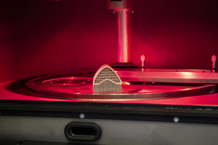 Object printed from metal powder on metal 3d printer, working chamber. Laser sintering machine for metal. Concept progressive additive DMLS, SLM, SLS 3d printing technology. 4.0 industrial revolution.の写真素材