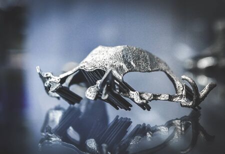 Object printed on metal 3d printer close-up. Object printed in laser sintering machine. Modern 3D printer printed from metal powder. Concept progressive additive DMLS, SLM, SLS 3d printing technologyの写真素材