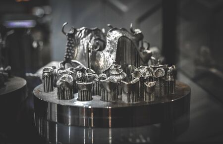 Object printed on metal 3d printer close-up. Object printed in laser sintering machine. Modern 3D printer printing from metal powder. Concept progressive additive DMLS, SLM, SLS 3d printing technologyの写真素材