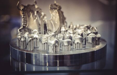 Object printed on metal 3d printer close-up. Object printed in laser sintering machine. Modern 3D...