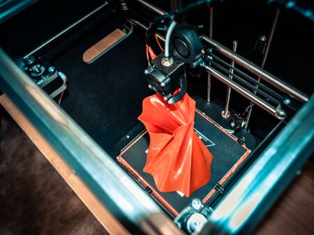 3D printer working close up. Automatic three dimensional 3d printer performs plastic. Modern 3D printer printing an object from the hot molten. Concept progressive additive technology for 3d printing.の写真素材