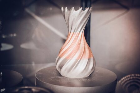 Object printed on metal 3d printer close-up. Object printed in laser sintering machine. Modern 3D printer printed from metal powder. Concept progressive additive DMLS, SLM, SLS 3d printing technologyの写真素材