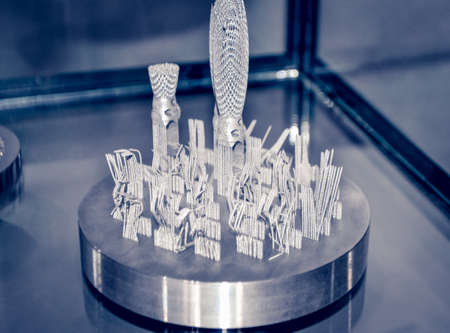 Object printed on metal 3d printer close-up. Object printed in laser sintering machine. Modern 3D...
