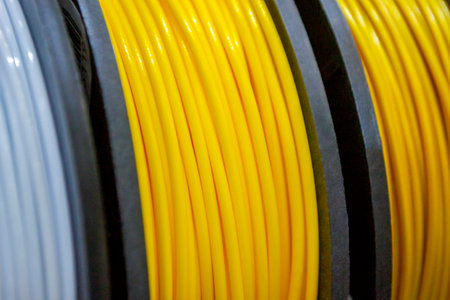 Multicolored filaments of plastic for printing on 3D printer close-up
