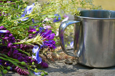 many flowers with camp mug of iron for tourismの写真素材