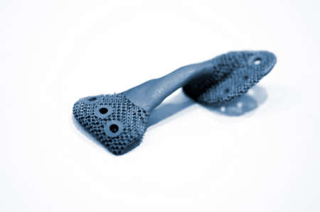 Object printed on metal 3d printer isolated on white background close-up.の写真素材