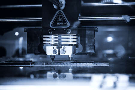 3D printer printing black shapes close-up Automatic three dimensional 3d printer