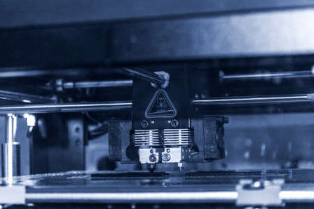 3D printer printing black shapes close-up Automatic three dimensional 3d printerの写真素材