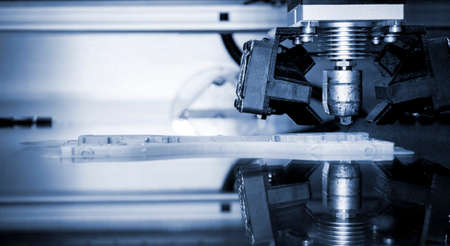 3D printer print isolated objects on mirror reflective surface close-up.