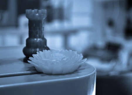 Abstract isolated object flower of a yellow color printed on a 3d printerの写真素材