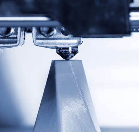 Modern 3D printer printing figure close-up. Automatic three dimensional