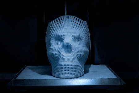 Model is printed on a 3d printer, the form of a skull.の写真素材