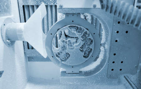 Dental milling machine carving out shape of human teethの写真素材