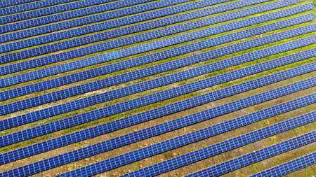 Aerial drone view flight over solar power station panels.の写真素材