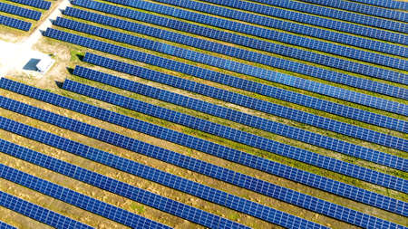 Aerial drone view flight over solar power station panels.の写真素材