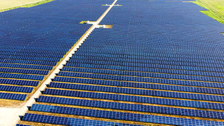 Aerial drone view flight over solar power station panels.の写真素材