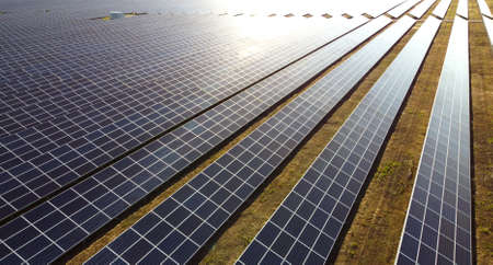 Aerial drone view flight over solar power station panels.の写真素材