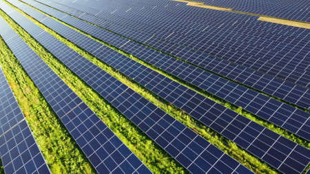 Aerial drone view flight over solar power station panels.の写真素材