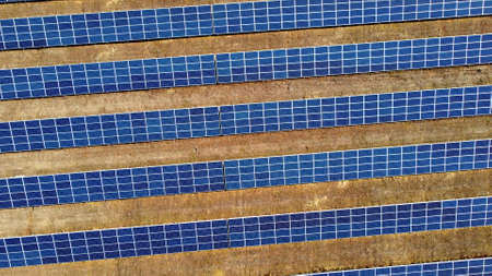 Aerial drone view flight over solar power station panels.の写真素材