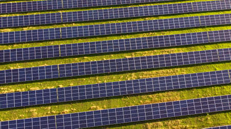 Aerial drone view flight over solar power station panels.