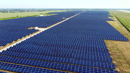 Aerial drone view flight over solar power station panels.の写真素材