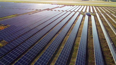 Aerial drone view flight over solar power station panels.の写真素材