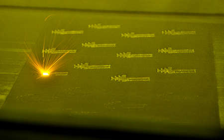 3D printer prints object from metal powder. Metal is sintered under laserの写真素材