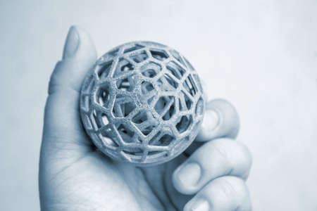 Person holding object printed on powder industrial 3D printerの写真素材
